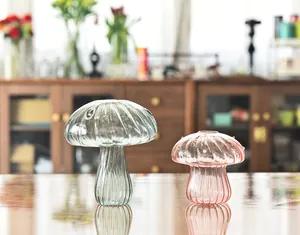 Set of two decorative mushroom-shaped ribbed glass vases in pink and grey green