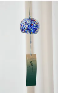 Detailed view of a handmade Japanese Edo glass wind chime with vibrant colorful speckles