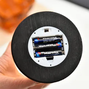 Close-up detail of the battery compartment and power switch on the night light base