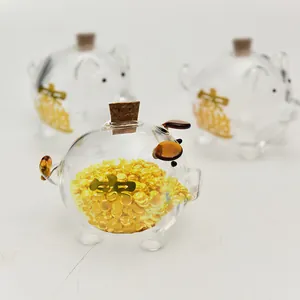 Hucha de cristal con forma de cerdo y tarro con decoraciones de oro