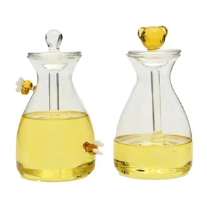 Dekoratives Honigglas-Set aus Glas mit Bienen-Deko und Bären-Griff-Glasrührstab