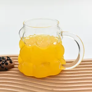 Creative grape-shaped glass mug with handle for juice or coffee, minimalist style design.