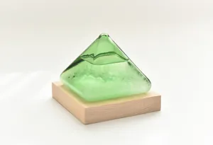 Detailed view of the green liquid and crystals inside the pyramid storm bottle