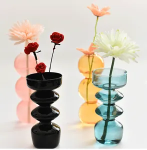 Modern colorful bubble glass vases for aesthetic home decor shown in four vibrant shades