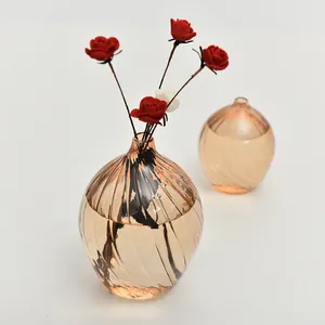 Elegant champagne colored glass vase with spiral texture for minimalist home decor
