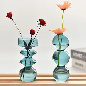 Artistic blue bubble glass vases with geometric stacked disc and sphere designs