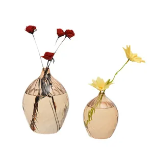 Elegant champagne-colored glass vases with spiral texture for home decor