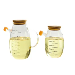 Ensemble de deux distributeurs d'huile en verre avec échelles et couvercles en bambou