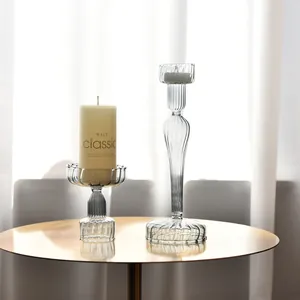 Detailed view of elegant striped glass candle holders on a stylish golden table.
