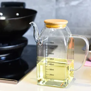 Premium 750ml borosilicate glass oil dispenser with bamboo lid and precise measurement scale