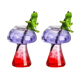 Macro view of creative mushroom-shaped glass cups featuring layered cocktail drinks