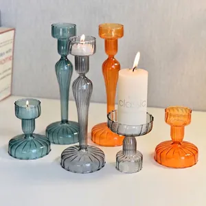 Ribbed colored glass candle holders in vintage styles for elegant dining table decor