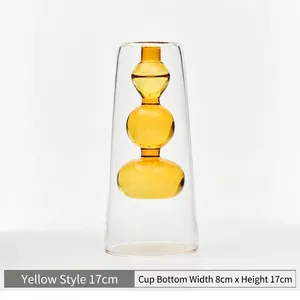 Detail of double-layer amber glass vase showing dimensions 17cm height and 8cm width