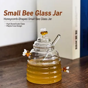 Detailed macro view of honeycomb-shaped borosilicate glass honey jar with lid and glass dipper