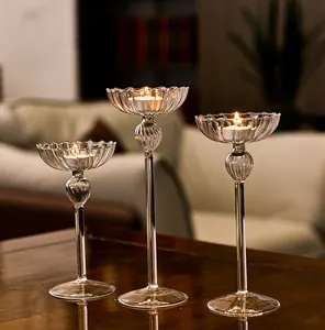 Elegant set of three ribbed glass candlestick holders for home decor and weddings.