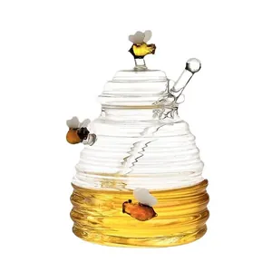 Elegant transparent glass honey jar set with honeycomb design lid and glass stirrer dipper