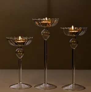Set of three elegant European style high-stemmed striped glass candle holders for home decor