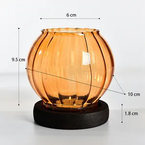 Elegant vintage amber ribbed glass candle holder with black wooden base 9.5cm height