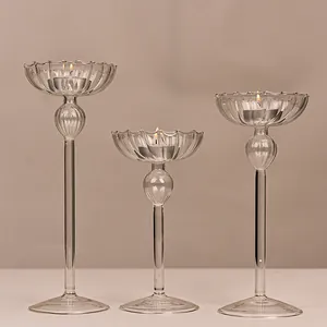 Elegant set of three fluted glass candlesticks for romantic candlelight dinners and home decor.