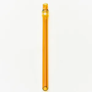 Close-up of a cute amber tiger-themed glass straw with pointed tip for milk tea