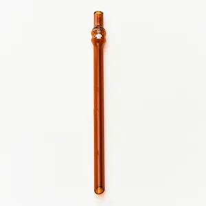 Close-up view of a cute tiger-shaped brown glass straw, heat resistant and reusable design