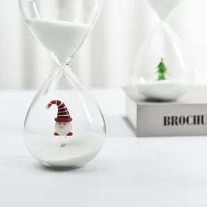 Christmas hourglass timer with decorative gnome and white sand in glass