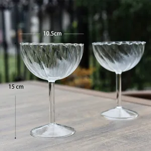 Hand-blown vertical ribbed glass champagne coupe with 10.5cm diameter and 15cm height