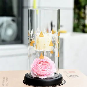 European style glass candle holder with festive tree patterns and pink peony base