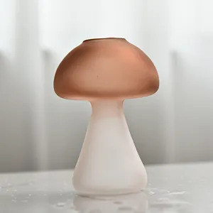 Detailed view of a two-tone frosted glass mushroom vase for creative home decoration