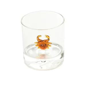 Creative transparent glass water cup featuring a unique 3D cartoon orange crab inside