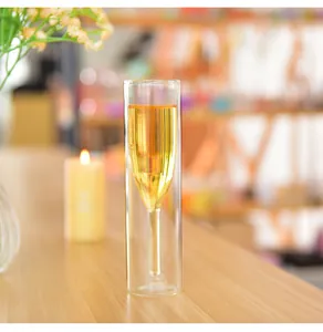Macro detail of a creative double-walled glass champagne flute showing the unique inner wine glass shape.