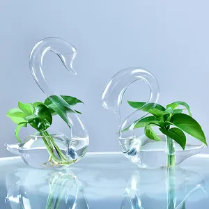 Elegant pair of clear swan-shaped glass vases for hydroponic plants and home decor