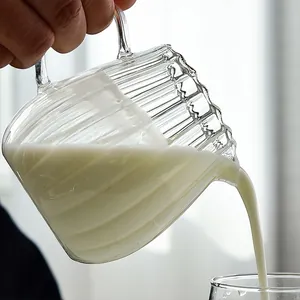 Heat-resistant ribbed glass milk pitcher with ergonomic handle and pour spout for coffee