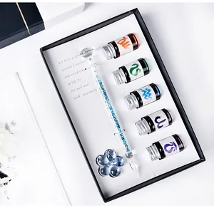 Detailed macro view of the luxury glass dip pen gift set including five ink bottles