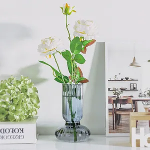 Nordic smoke grey striped glass vase with white artificial roses for home decor.