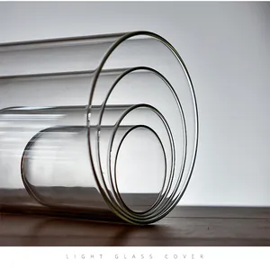 Detail view of nested clear glass cylinder covers for DIY micro landscape displays
