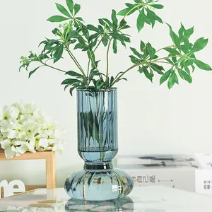 Nordic smoky grey ribbed glass vase for hydroponic floral arrangements on a table