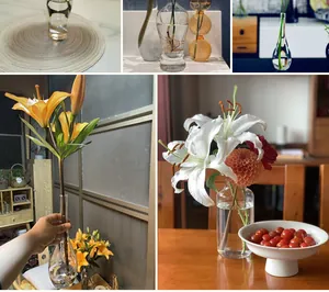 Detailed view of minimalist Japanese glass vases with lilies in a cozy home setting.