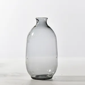 Minimalist grey translucent glass aromatherapy vase with a smooth rounded body for decor