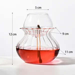 Vintage handmade clear glass oil lamp with red liquid and detailed dimension markings