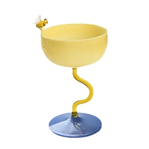 Modern creative yellow glass dessert cup with blue base and unique spiral stem design