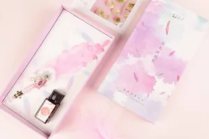 Elegant feather glass dip pen set with pink ink bottle in a luxury gift box packaging