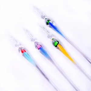 Detailed view of four colorful jellyfish-themed glass dip pens for ink sketching