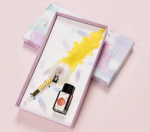 Creative yellow feather dip pen gift set with glass nib and 20ml ink in a beautiful gift box