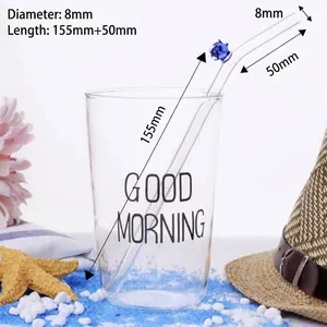 Cannuccia riutilizzabile in vetro borosilicato con fiore blu e diametro di 8 mm.