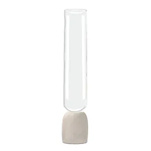 Jarrón de cristal cilíndrico de estilo nórdico con una base de mármol blanco sólido