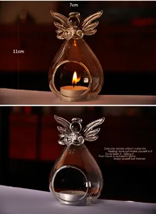 Detailed view of the angel-shaped glass candle holder with 11cm height and 7cm width dimensions
