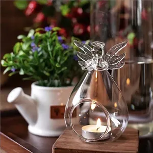 Decorative clear glass angel-shaped candle holder and flower vase for home aesthetics
