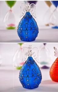 Blue glass angel figurine with rhinestones and height dimensions displayed.