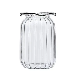 Modern minimalist ribbed transparent glass vase with elegant ruffled rim for desktop floral decor